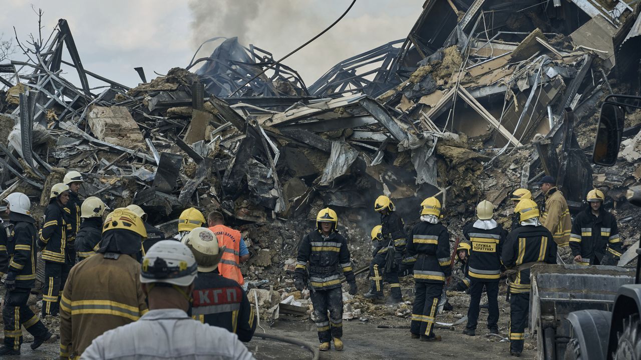 Emergency service personnel work at the site of a destroyed building after a Russian attack in Odesa, Ukraine, July 20, 2023. 