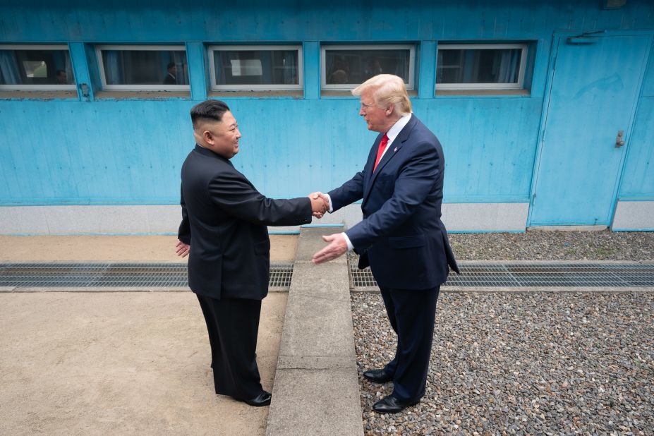 Trump shakes hands with North Korean leader Kim Jong Un as the two <a href=